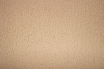 Beige plaster on the wall