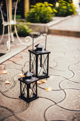 Fototapeta na wymiar Vintage decorative lantern with a candles Wedding ceremony