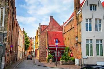 Fototapeta na wymiar Beautiful narrow streets and traditional houses in the old town of Bruges (Brugge), Belgium