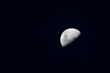 Recife / Pernambuco / Brazil. May, 01, 2020. Crescent moon, seen in Recife, Pernambuco, at 17:11 pm, lunar age 8 days, 52% luminance. On this day the distance from the moon Earth is 372,299 km.   