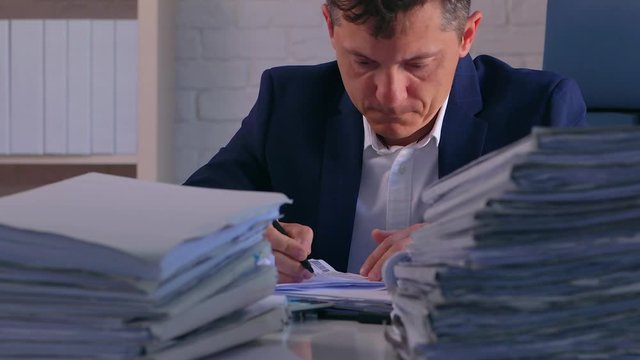 Overworked Exhausted Prosecutor Preparing His Statement for the Lawsuit.