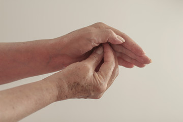hands of the elderly woman