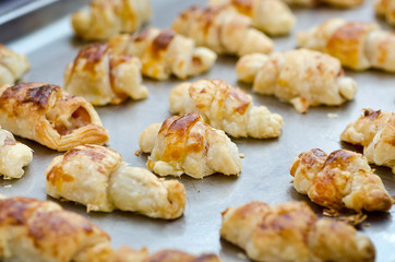 Fresh croissants on a tray, ready for serving