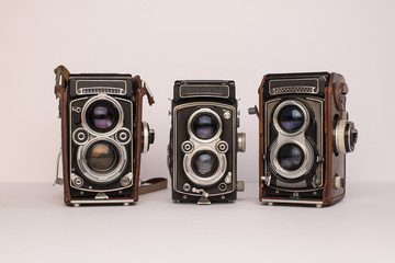 three vintage film medium format cameras