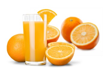 Orange juice in glass and slices of orange fruit