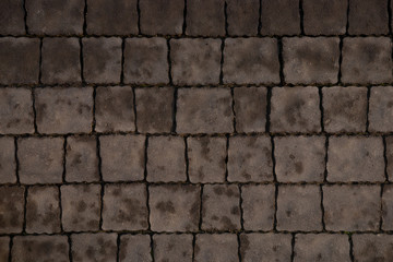Square cobbles in lines. Natural stone textured background