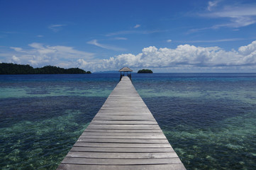 long wooden jetty in togian islands in indonesia