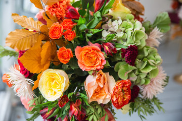 table decoration, bouquet, autumn bouquet, maple leaves, florist's workshop