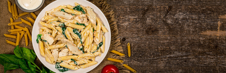 Chicken Alfredo Pasta with Spinach. Selective focus.