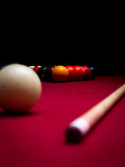 Billiard balls on a red felt pool table