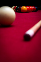 Billiard balls on a red felt pool table