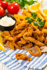 Crispy Breaded Clam Strips Snack Size. Deep Fried Breaded Clams Fingers with Tartar Dipping Sauce. Selective focus.