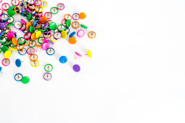Close up of various colorful pushpins on white background with clipping path with place for text