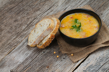 Delicious pea soup with smoked sausage.