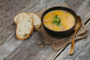 Delicious pea soup with smoked sausage.