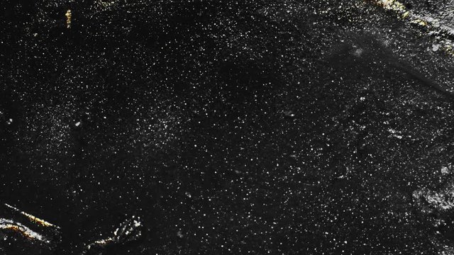 Metallic fluid overlay. Cosmic dust. Glitter black golden grain paint flow.