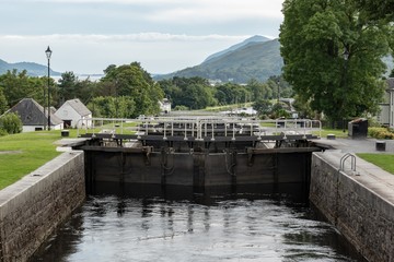Fototapeta premium Detail of gate locks at Caledonian Canal in Fort William, Scotland. It connects Inverness, Fort Augustus, Loch Ness and Lochy and Fort William.
