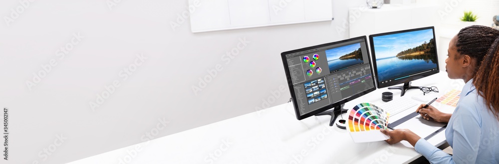 Poster editor editing video on computer