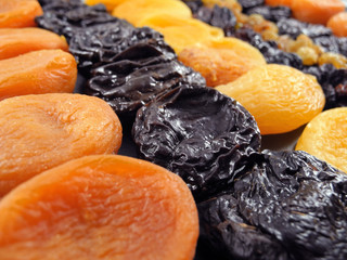 Background of dried apricots, prunes and raisins. Healthy snack.