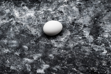 egg on a dark grunge background