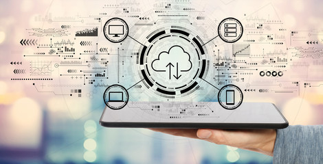 Cloud computing with man holding a tablet computer