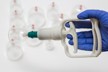 Jars for hijama. Vacuum pumps on a white background