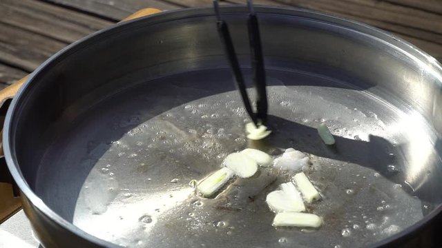 Fry the garlic before the meat