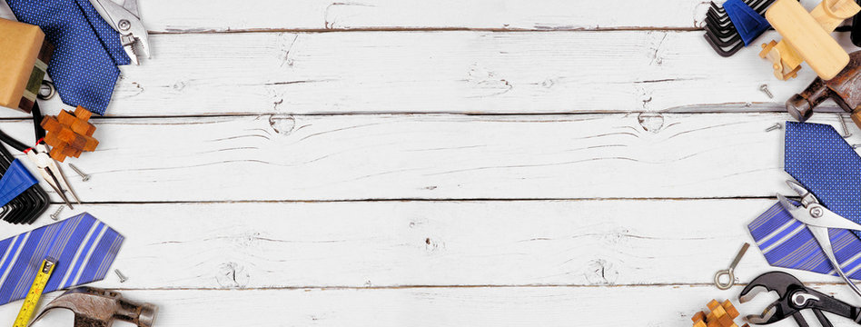 Fathers Day theme double border of gifts, tie and tools on a white wood banner background. Top view with copy space.