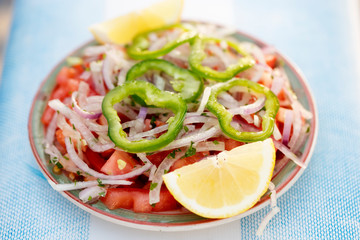 Moroccan salad with tomato, red onion, green pepper, parsley and lemon 