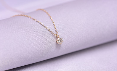 diamond necklace on a silk background