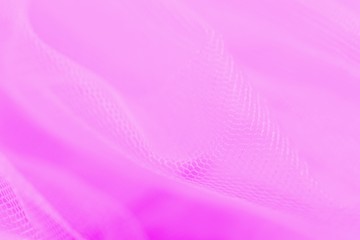 Light small mesh fabric on pink background