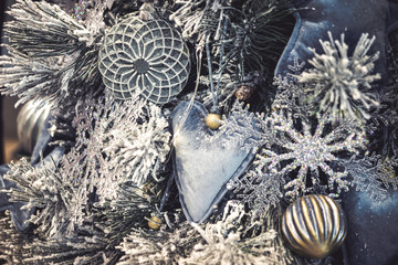 Decorative snow-covered Christmas tree decorated with decorative
