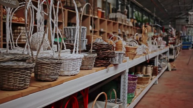 Variety of wicker baskets on shelves in home decor store