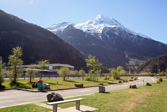 Rest Area on the highway along the river Reuss near the town of Silenen. View of the snow-capped mountain Bristen. Canton of Uri, Switzerland.