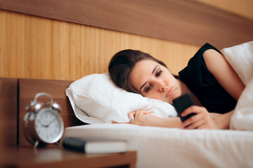 Stressed Woman Checking Smartphone First Thing in the Morning