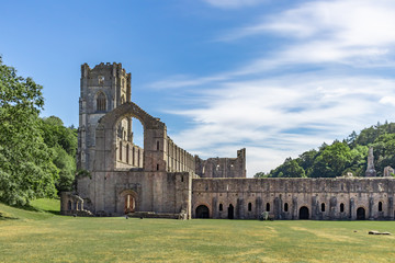 Fototapeta premium Historic Fountains Abbey and Studely Royal on a warm summer day.