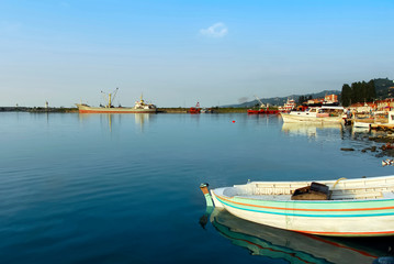 Fototapeta na wymiar TRABZON / TURKEY - AUGUST 28, 2006: Harbor and Boats, Black Sea. Of District