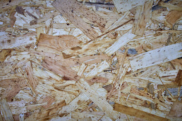 Wood panel made from wood chips texture background.