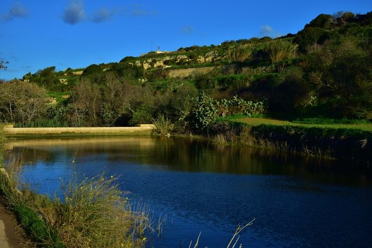 Wide angle shot of a manmade lake in Chadwick Lakes, Malta