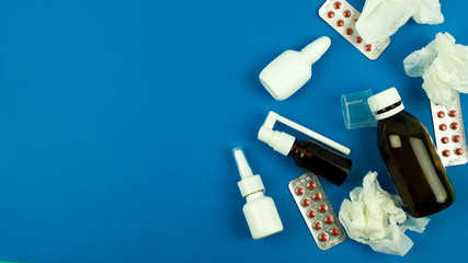pills and medicines on a blue background, concept of medicine and healthcare health and treatment, place for text, top view