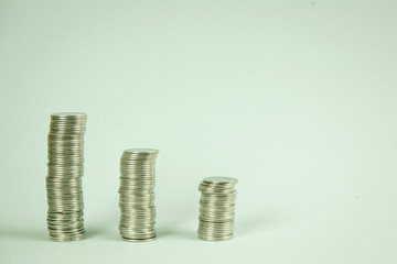 Stacks of coins on a gray background, Growth and preservation of money, concept of finance and economy