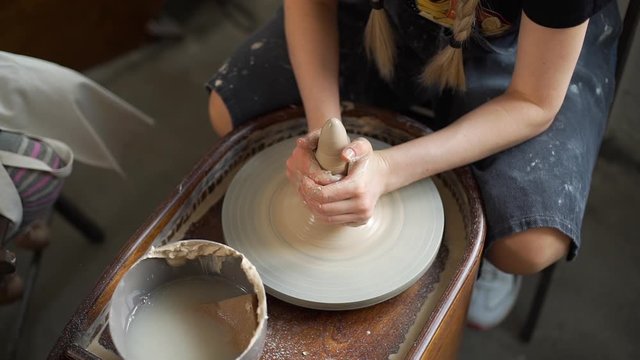 Closeup of Woman Working on a Sculpting Wheel. Pottery Workshop for Kids. Craft and Clay Art, Child Creative Education Activities