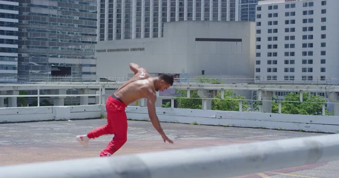 Male break dancer in city