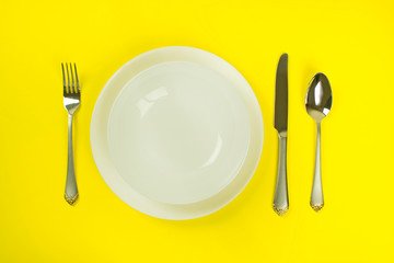 utensils and kitchen utensils, plates and fork spoon and knife, etiquette rules, cutlery and cooking and food concept