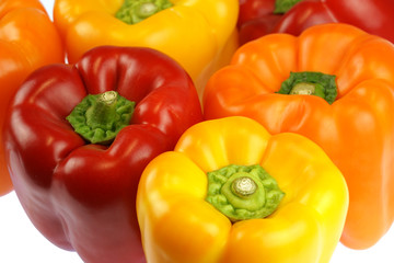 close up on fresh colorful peppers isolated on white background