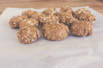 topview of homemade oat cookies on bakery paper