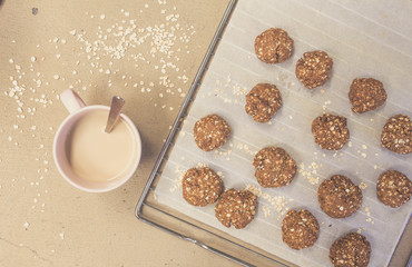 Topview homemade oat cookies over baking tray