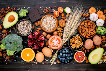 Ingredients for the healthy foods selection. The concept of healthy food set up on wooden background.
