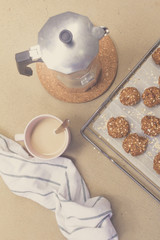 homemade oat cookies, coffee cup and moka pot