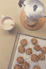 homemade oat cookies, coffee cup and moka pot
